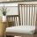 chair and side table in well lit clubhouse