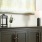 room with a console table and framed wall art