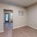 a room with a wood floor and partition wall