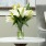 a vase with flowers on a table