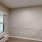ac unit in room with large window