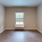 a room with a window and a wood floor