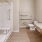 handicap features in well lit bathroom with walk-in shower