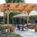 outdoor patio with pergola covered tables and chairs