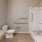 large bathroom with handicap features